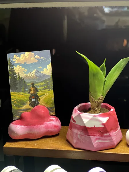 Hand-cast pink cloud photo holder and marbled geometric planter