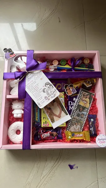 DIY hamper with figurines, paints and photo film bookmark